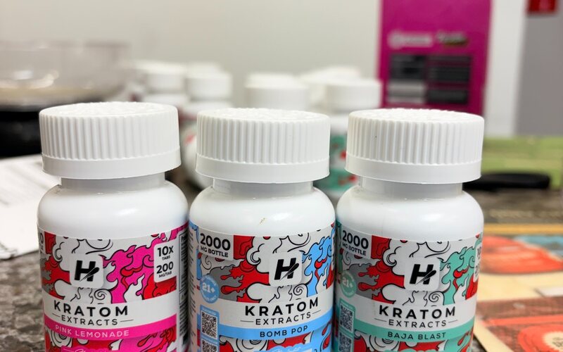 Bottles of kratom extract on the counter.